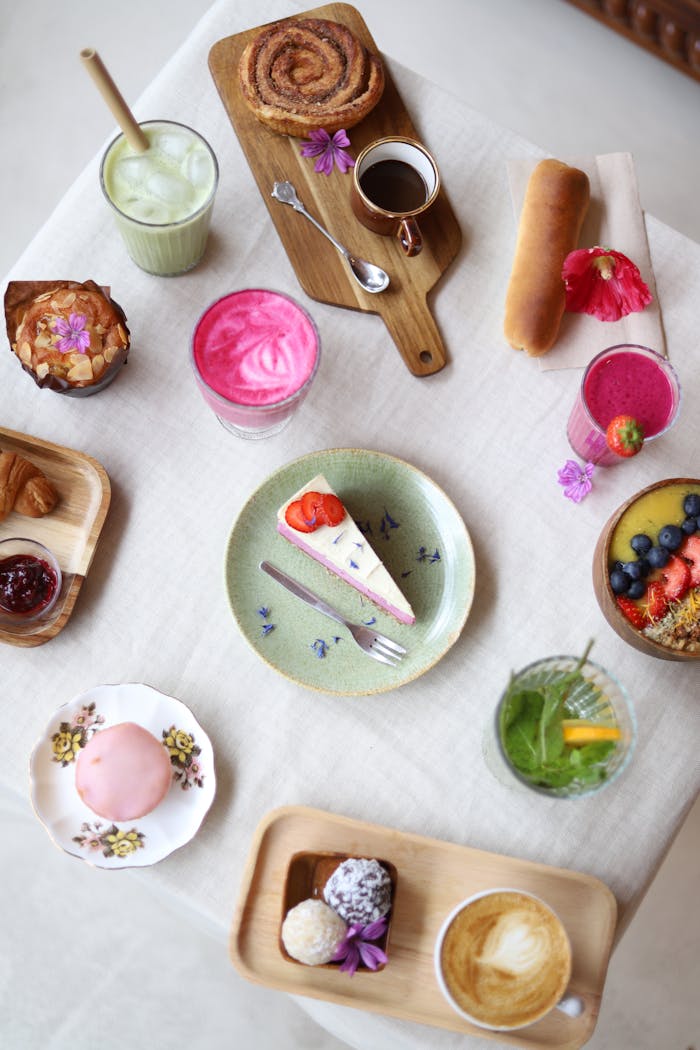 The Art of Drawing Readers In: Your attractive post title goes here Vibrant flat lay of assorted desserts and beverages on a table setting, perfect for food photography enthusiasts.